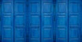 Mediterranean style style blue window sun or storm shutters closed. Royalty Free Stock Photo