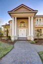 Mediterranean style waterfront home with stucco walls and columned porch Royalty Free Stock Photo