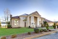 Mediterranean style waterfront home with stucco walls and columned porch Royalty Free Stock Photo