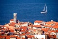 Mediterranean town and a sailboat