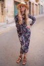 Mediterranean woman floral pattern dress posing