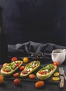 Mediterranean stuffed zucchini sticks with tomato, olives and cheese. Served and ready to eat. Royalty Free Stock Photo