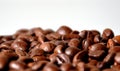 Medium brown fresh roasted coffee bean pile closeup