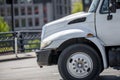 Medium class rig semi truck tractor running on the city street Royalty Free Stock Photo