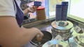 Worker serving Italian gelato at Grom Shop, Italy