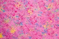 Medium density fiberboard surface with predominantly pink water-based paint Royalty Free Stock Photo