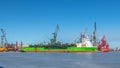 Green supply ship in a shipyard. Royalty Free Stock Photo