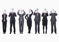 Medium group of business people in a row holding up paper with question mark, obscured face, studio shot