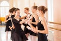 Medium group of teenage girls having fun and relaxing after ballet class