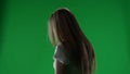 Medium half turn green screen, chroma key shot of a posessed female figure, ghost, poltergeist, zombie standing still