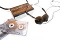 Medium plane, white background depicting elements of the 90s. Basic 90`s music kit, cassette tape player, retro headphones, Royalty Free Stock Photo