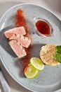 Medium Rare Ahi Tuna Steak with Red Spices Powder, Rice and Lime Top View Royalty Free Stock Photo