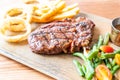 medium rare beef steak with vegetable and french fries Royalty Free Stock Photo