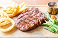 medium rare beef steak with vegetable and french fries Royalty Free Stock Photo