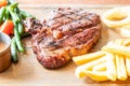 medium rare beef steak with vegetable and french fries Royalty Free Stock Photo