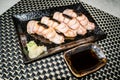 Medium Rare beef sushi on a black plate is ready to serve in Japanese style Royalty Free Stock Photo