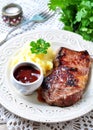 Medium rare grilled Beef steak with mashed potatoes and barbecue sauce Royalty Free Stock Photo