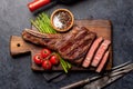 Medium rare grilled Tomahawk beef steak with asparagus Royalty Free Stock Photo