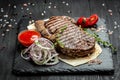 Medium rare Ribeye steak or beef steak. Dry Aged Barbecue Ribeye Steak beef steak sliced with large fillet piece. banner Royalty Free Stock Photo