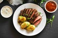 Sliced medium rare roast beef with potato Royalty Free Stock Photo