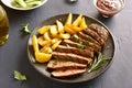 Medium rare roast beef with potato wedges Royalty Free Stock Photo