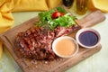 Medium Ribeye steak with spices on the wooden tray. Steak beef. Beef steak medium withwith mix salad. Royalty Free Stock Photo