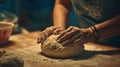 Medium shot of a baker demonstrating kneading method in an intimate evening workshop focusing on hand movements while Royalty Free Stock Photo