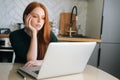 Medium shot of bored young woman office worker tired unmotivated and disinterested in dull work with laptop.