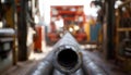 Medium shot capturing horizontal well corridor inside drilling site focusing on the drill pipes forward section with the Royalty Free Stock Photo