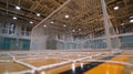 Medium shot capturing a squash ball rebound net mounted in an indoor court emphasizing fastpaced training with Royalty Free Stock Photo