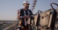 Engineer working on a cellular tower