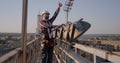 Engineer working on a cellular tower