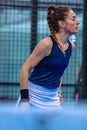 Medium shot of a female padel player with her eyes closed, lamenting after missing a ball in the match Royalty Free Stock Photo