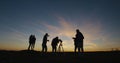 Friends stargazing together using a professional telescope