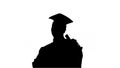 Silhouette Happy african american male student in graduation rob