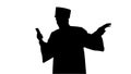Silhouette Smiling male student in graduation gown showing campu