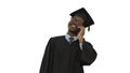 Smiling african american male student in graduation robe talking Royalty Free Stock Photo