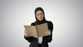 Surprised Muslim Businesswoman reading business diary and shakin Royalty Free Stock Photo