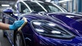 Medium shot of glossy highgloss ceramic coating being spread across a vehicles surface highlighting the reflective Royalty Free Stock Photo