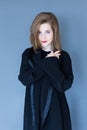 Medium shot of gorgeous young woman dressed in chic black clothes