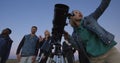 Friends stargazing together using a professional telescope Royalty Free Stock Photo