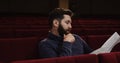 Man watching a theater performance alone Royalty Free Stock Photo