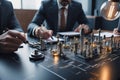 Medium shot people sitting indoors,A group of people sitting around a table,holding business papers Royalty Free Stock Photo