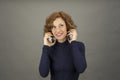 Medium shot portrait of curly hair young woman with headphones