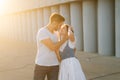 Medium shot portrait of romantic young couple in love embracing while man touching neck of girlfriends with hand. Royalty Free Stock Photo