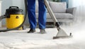 Medium shot of a professional using hot water extraction on a carpet lifting deepseated dirt and grime efficiently for a Royalty Free Stock Photo