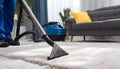 Medium shot of a professional using hot water extraction on a carpet lifting deepseated dirt and grime efficiently for a Royalty Free Stock Photo