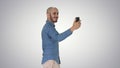 Happy smiling handsome young man making selfie while walking on Royalty Free Stock Photo