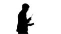 Silhouette Thinking businessman writing notes in his notebook wh Royalty Free Stock Photo