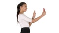 Young latin formal woman making a video call or recording video blog on white background.
